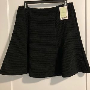 Nice black skirt 18 inches long from waist to bottom zipper on the back